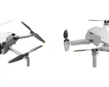 Dwa białe drony, jeden z przodu z kamerą, drugi z boku. Dron zasięg 10km, idealny do podniebnych podróży.