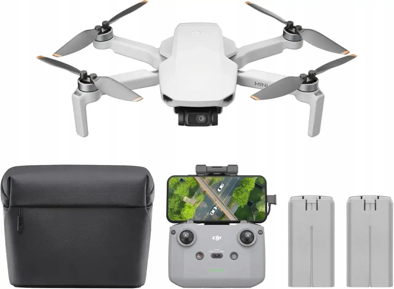 Biały dron z akcesoriami: etui, kontroler z telefonem i dwie baterie. To Twój pierwszy dron, gotowy do lotu!